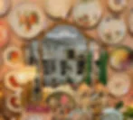 Plate wall around vintage vanity mirror