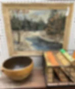 Vintage painting, bowl, and basket of books