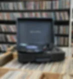 Vintage Crosley record player with vinyl records in crates
