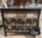 Vintage dresser painted black with wallpaper drawer fronts