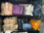 Collection of coach bags in display case